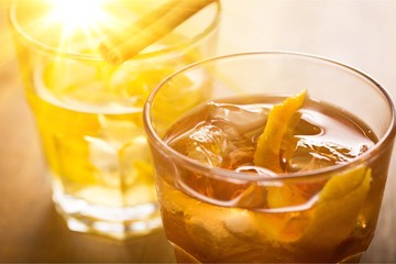 Close-up of fresh orange drinks on table