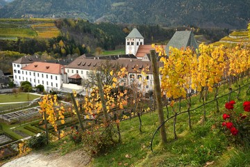 Novacella Monastery with vineyards during autumn season. Located in Varna, Bolzano, Trentino...