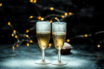 two glasses of champagne on dark, romantic, calm background