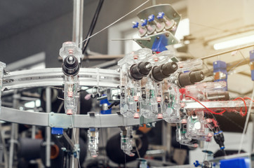 Details of knitting machines in the factory, springs, threads, guide elements