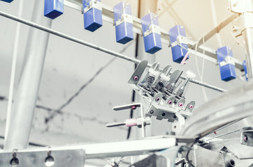 Details of knitting machines in the factory, springs, threads, guide elements