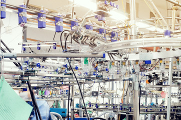 Details of knitting machines in the factory, springs, threads, guide elements