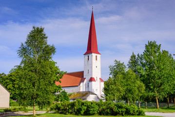 Fototapeta na wymiar Sightseeing of Saaremaa island. Medieval Lutheran church of St. Michael in the village of Kihelkonna, Saaremaa island, Estonia