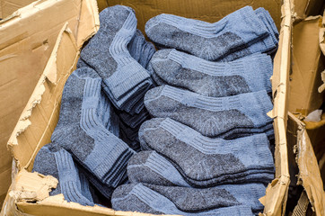 Warm socks folded in a cardboard box in a factory