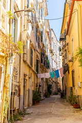 Corfu, Greece - 16.10.2018: View of typical narrow street of an old town of Corfu in Greece