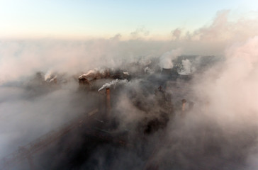 Industrial city of Mariupol, Ukraine, in the smoke of industrial plants and fog at dawn.