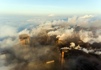 Industrial city of Mariupol, Ukraine, in the smoke of industrial plants and fog at dawn.