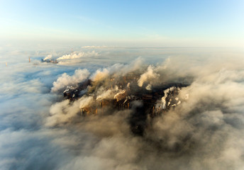 Industrial city of Mariupol, Ukraine, in the smoke of industrial plants and fog at dawn.