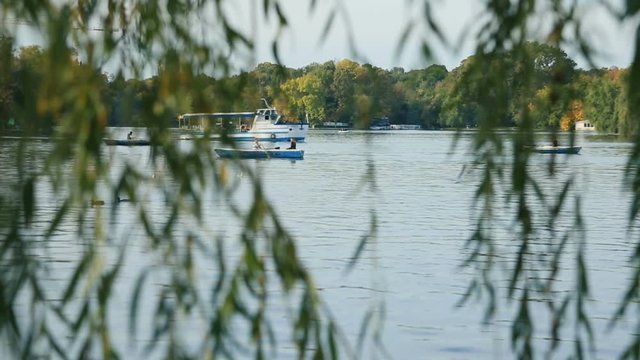 BUCHAREST, ROMANIA - cca. 2015: People Boat Ride On Herastrau Lake In Herastrau Public Park.