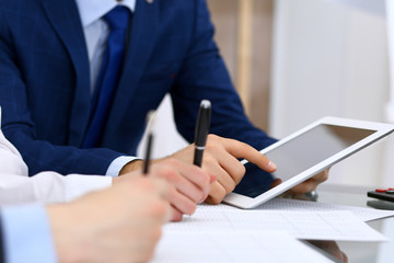 Bookkeepers team or financial inspectors  making report, calculating and checking balance. Tax service financial document. Audit or meeting concept