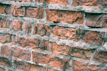 The texture of the brickwork with broken bricks