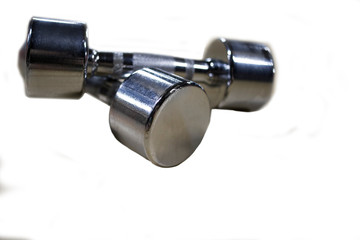 heap OF black dumbbells lying on the floor,black carpet. Iron dumbbells for Weight Lifting in the Gym. Toned picture for your design