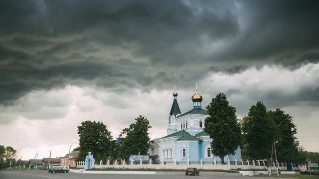 St. John The Korma Convent Church In Korma Village, Dobrush District, Belarus. Famous Orthodox Church Against Background Of An Approaching Storm. Time-lapse, Timelapse,