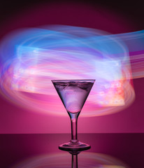 Martini glass on the background of neon lights