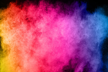 abstract colored dust explosion on a black background.abstract powder splatted background.