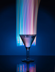 Martini glass on the background of neon lights