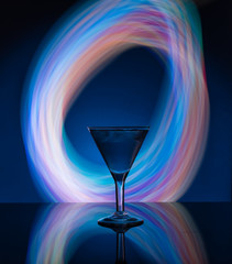 Martini glass on the background of neon lights