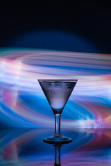 Martini glass on the background of neon lights