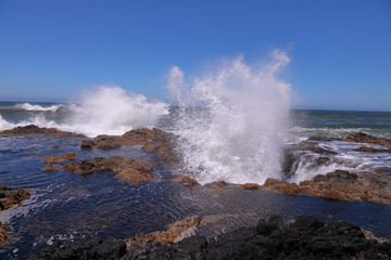 Water erupting from Thor's Well - a natural blow hole at Oregon coast near Yachats