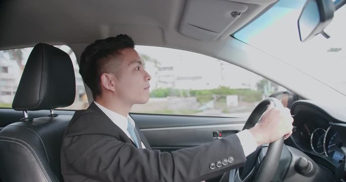 business man driving car