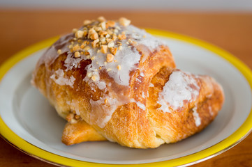 Polish traditional Saint Martin's croissants known in Poland as rogal swietomarcinski. Traditional pastries from Poznan with white poppy seeds and nuts. - obrazy, fototapety, plakaty
