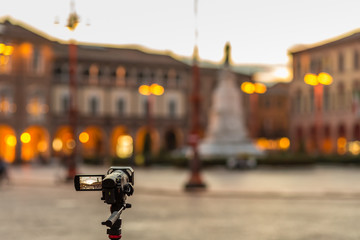 camcorder filming sunset on Italian town
