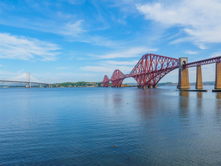 The iconic Forth Rail Bridge over the Firth of Forth (on the right) with the older Forth Road...
