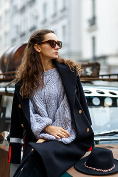 Stylish young brunette woman on the street