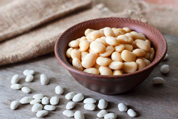Boiled white kidney beans in a rustic bowl