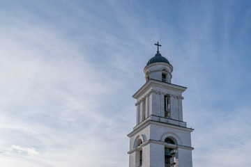 Fototapeta na wymiar The Metropolitan Cathedral Nativity of the Lord steeple towards a blue sky, in Chisinau, Moldova