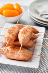 Minced turkey kebabs on square white plate