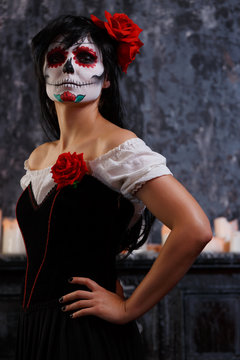 Image of zombie girl with makeup and roses on face