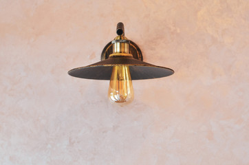 Retro light bulb hanging on the wall as decoration