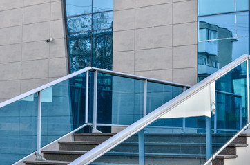 Fragment of stairs in the building made of glass.