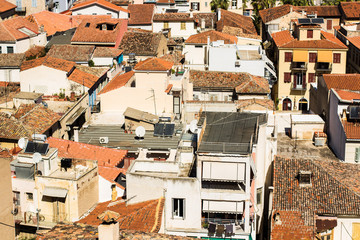 shingles orange roofs of city down-town district people apartment houses aerial  foreshortening...