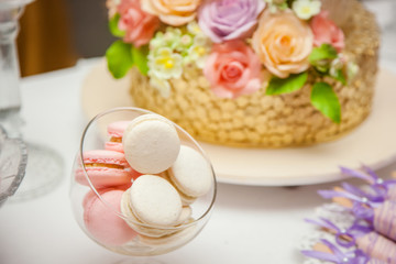 Delicious sweets on wedding candy buffet with desserts, cupcakes