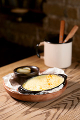 fish baked with cheese and salted cucumbers