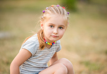 cute little girl in the summer wood