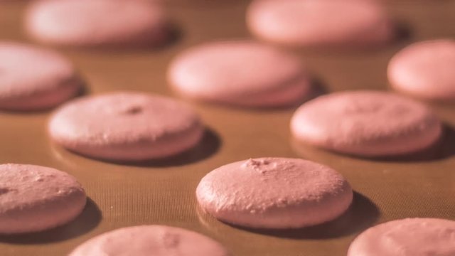 process of macarons baking in oven with camera zoom effect