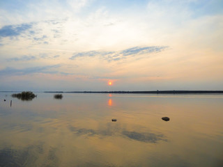 Obraz na płótnie Canvas Sunset in the Uruguay river, view from Bela Vista neighborhood - Uruguaiana, Brazil