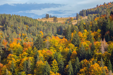 Autumn landscape view from the village of Fotinovo to the colorful hills of Rhodope Mountain, Bulgaria.