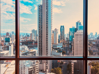 Fototapeta na wymiar view from skyscraper window on modern city skyline 