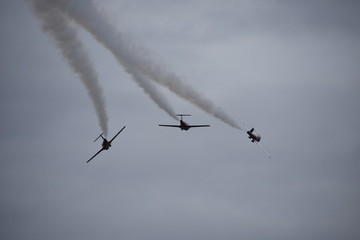 3 planes doing tricks at airshow