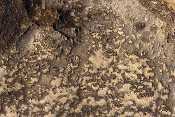 wet sand in the stone grooves