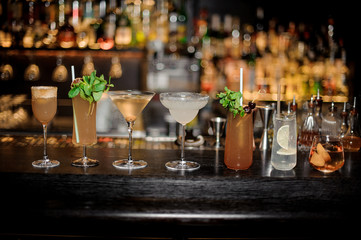 Set of classic cocktails: Dirty Martini, Sherry Cobbler, Brandy Crusta, Margarita, Cobras Fang, Tom Collins and Captain James Cook