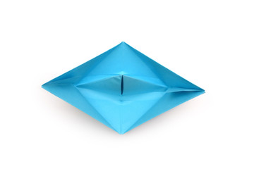 A bright blue paper origami boat. View from above