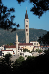 Minaret And Bell Tower In Mostar, Bosnia And Herzegovina