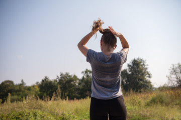 woman jogging along a country road