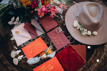 A wedding concept. Invitation and items, Different colored paper envelopes on the table, background.