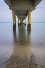 A Beautiful long exposure picture of a jetty. Image contain certain grain or noise and soft focus...